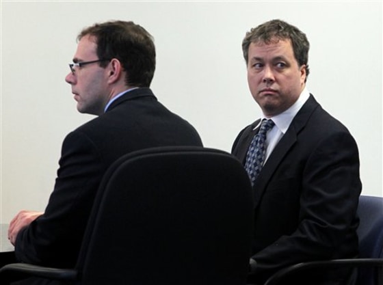 Mark Kerrigan, right, looks at his family Tuesday during his involuntary manslaughter trial at Middlesex Superior Court in Woburn, Mass.